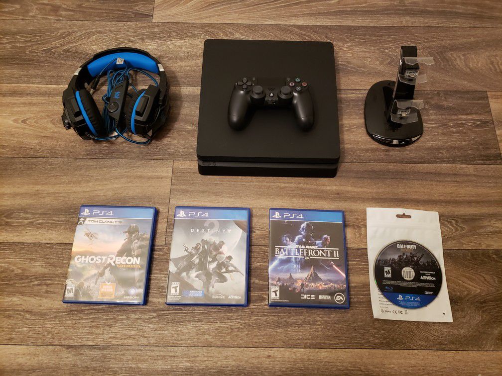 Playstation 4 [PS4] 500 GB Slim Console Bundle, 4 Games, Fornite Skins, Gaming Headset, & LED Charging Dock