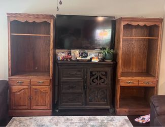 Two oak curio cabinets with lights