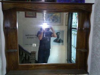 Wood shelves and mirror can be wall mounted or put on the back of a piece of furniture