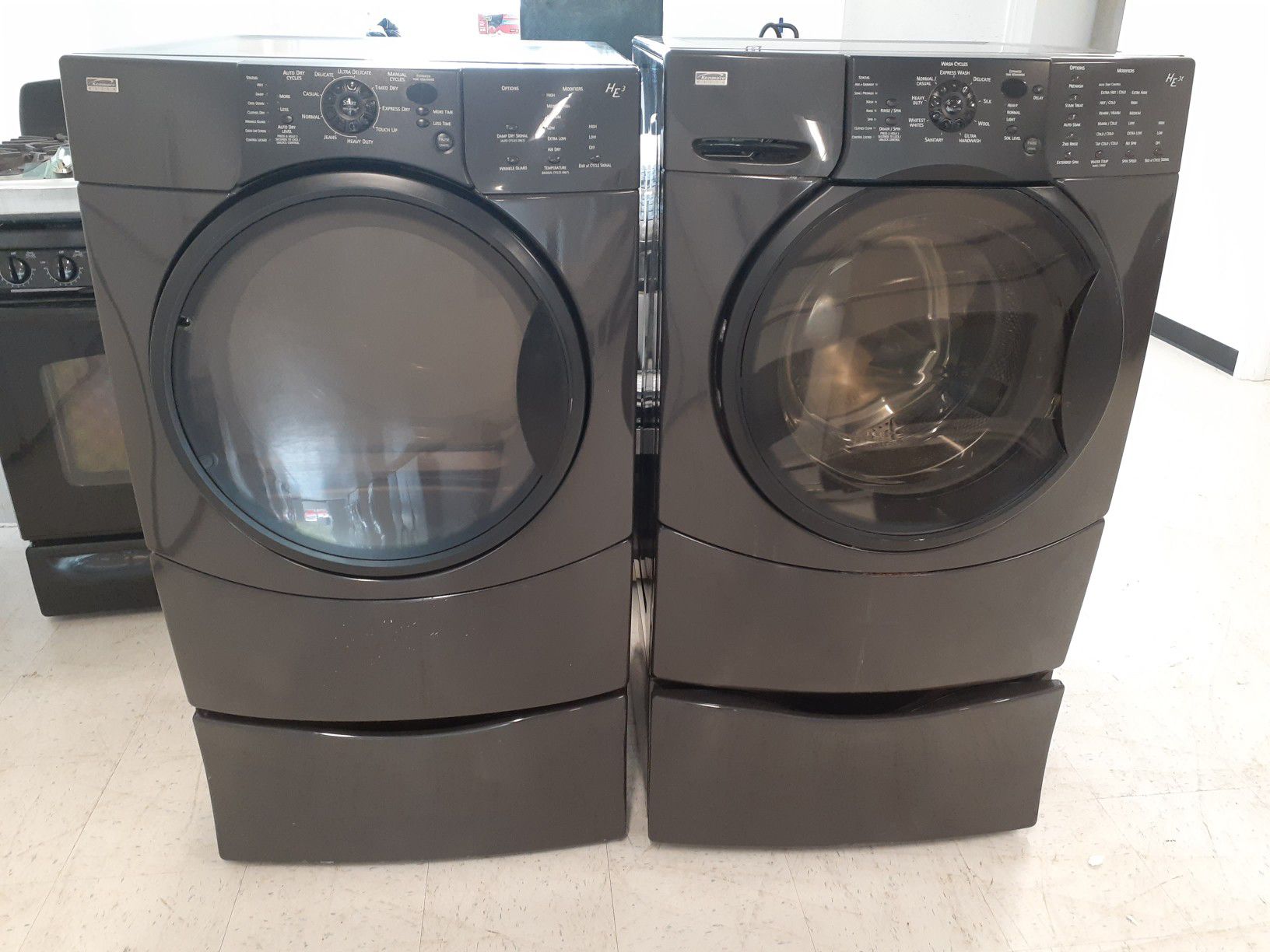 Kenmore front load washer and electric dryer set with pedestal in good condition with 90 day's warranty