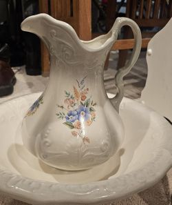 Beautiful vintage ceramic wash basin and pitcher set in a soft ivory glaze with delicate embossed swirl detailing.