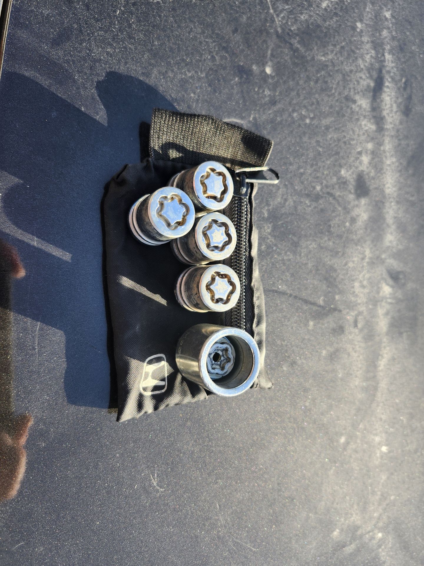 OEM Honda wheel lock set with pouch
