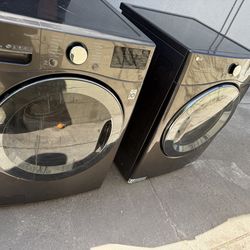 Grey LG washer and gas dryer