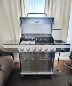 New. Nexgrill Gourmet Pro 6-Burner Stainless Steel Propane Gas Grill with Searing Side Burner and Griddle Max Insert.
