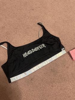 Headbanger black top with a shimmering holographic underband. Scoop neckline and adjustable thin straps for a secure, comfortable fit. Stretch swim fa