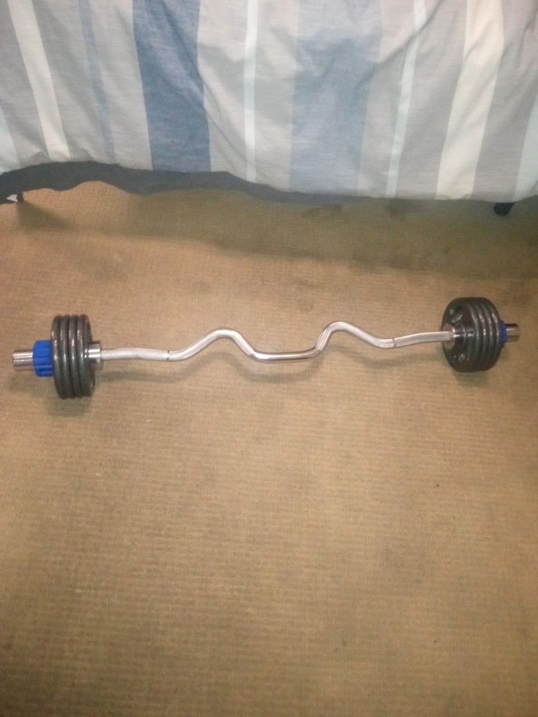 Cap Solid 1 Peice Curl Bar With 40 Pound Plates Comes With Custom Plate Locks " Blue" And 15 Pound Weight