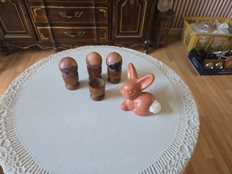 3 Painted eggs with wooden holders