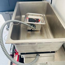 Stainless APW Wyott complete well with drain. Genuine OEM replacement part, part number 56562. Good for commercial kitchen.