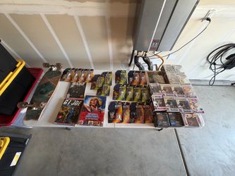 Long board, books action figures and Funkos
