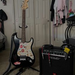 Squier Stratocaster electric guitar with Peavey Rage 158 guitar amplifier