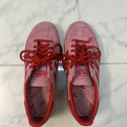 Pink and Red adidas shoes