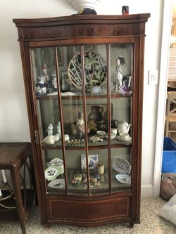 Antique wood curio cabinet