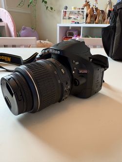 Nikon D5200 with extra batteries, SD cards, carrying case and adapter