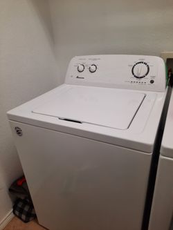 Amana white washer and dryer.