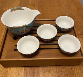 Tiny tea cups and pouring pitcher