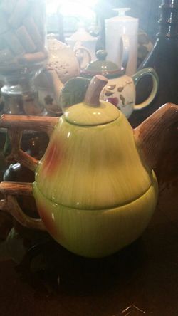 Tea pot on top of cup