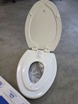 Bemis NextStep2 Elongated Toilet Seat with Built-In Potty Training Seat
