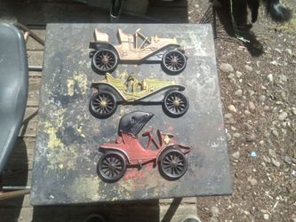 3 Vintage Cast Aluminum Automotive Wall Hangers, Great Condition. $10.00.
