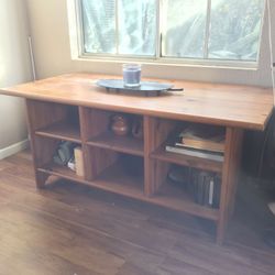 Wooden table with shelves
