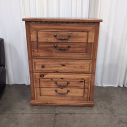 Honey-Toned Wood Four-Drawer Dresser with Decorative Molding