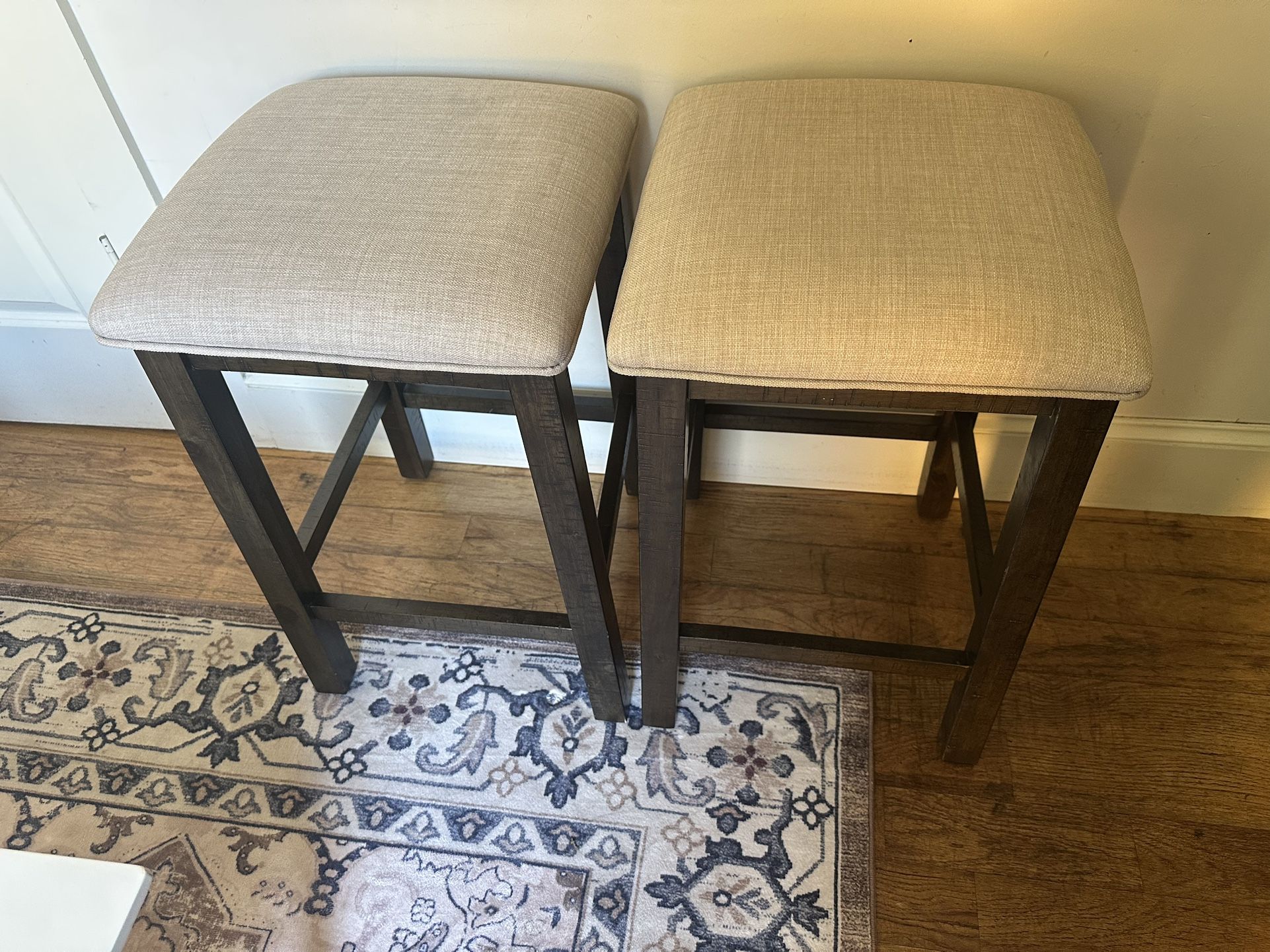 2 Dark Brown Wooden Stools With Beige Cushion