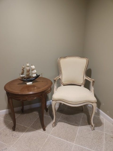French Louis XV-style armchair, characterized by its curving back,