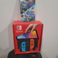 NINTENDO SWITCH OLED NEON RED AND BLUE WITH BRAND NEW SUPER MARIO GALAXY 1&2 BUNDLE