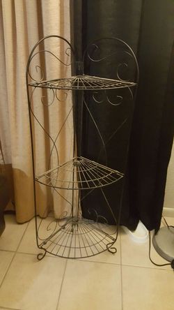 Corner metal shelf