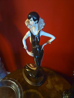 Porcelain woman sculpture.