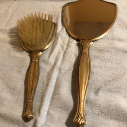 Beautiful vintage wicker back mirror and brush dresser set