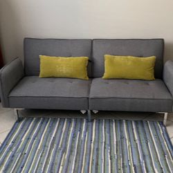 Grey futon in brand new condition with tag