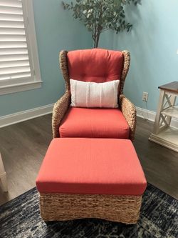 Wicker chair and ottoman with coral color cushions
