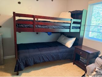 Bunk beds with two twin mattresses, a night stand, 6 drawer dresser and bedding.