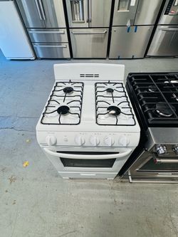 White Hotpoint stove for a small apartment; includes a receipt for a 60-day warranty.