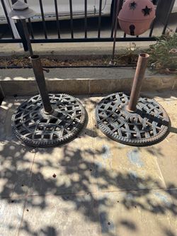 Pair of vintage-style cast iron patio umbrella bases