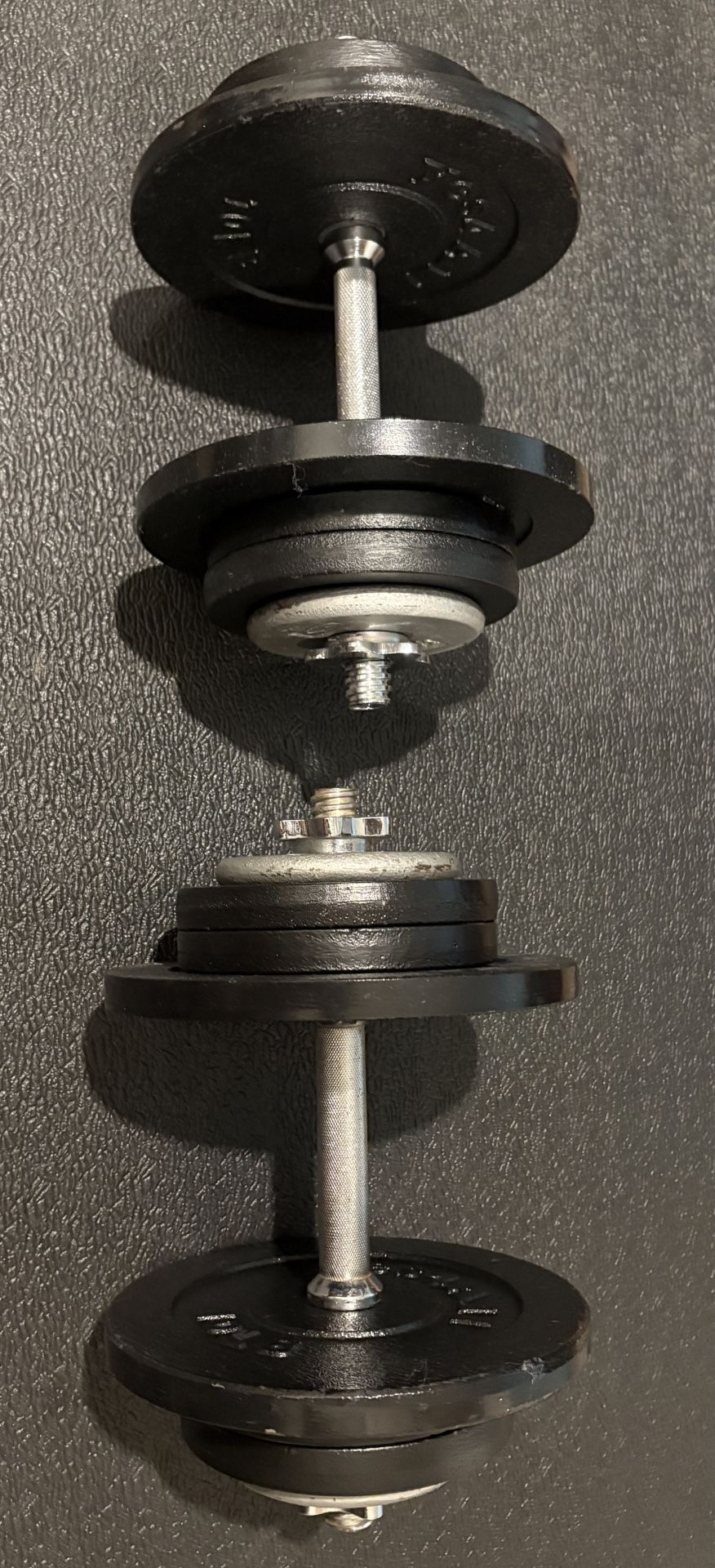 Adjustable Set of Dumbbells. Cast Iron, New Condition 50# per hand [ Total: 100 lbs]