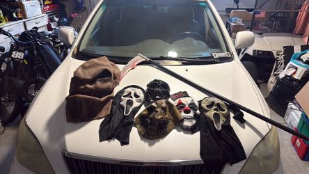Halloween masks and Grim Reaper knife thing scream clown skull