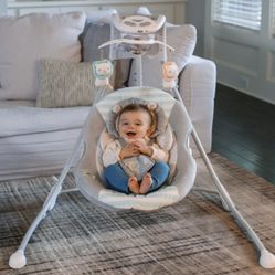 Ingenuity InLighten Baby Swing, Easy-Fold Frame, Swivel Infant Seat, Lights - Landry the Lion (Unisex )BRAND  NEW