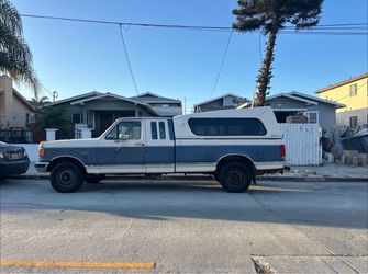 Ford F-250 Extended Cab Pickup Truck with Camper Shell