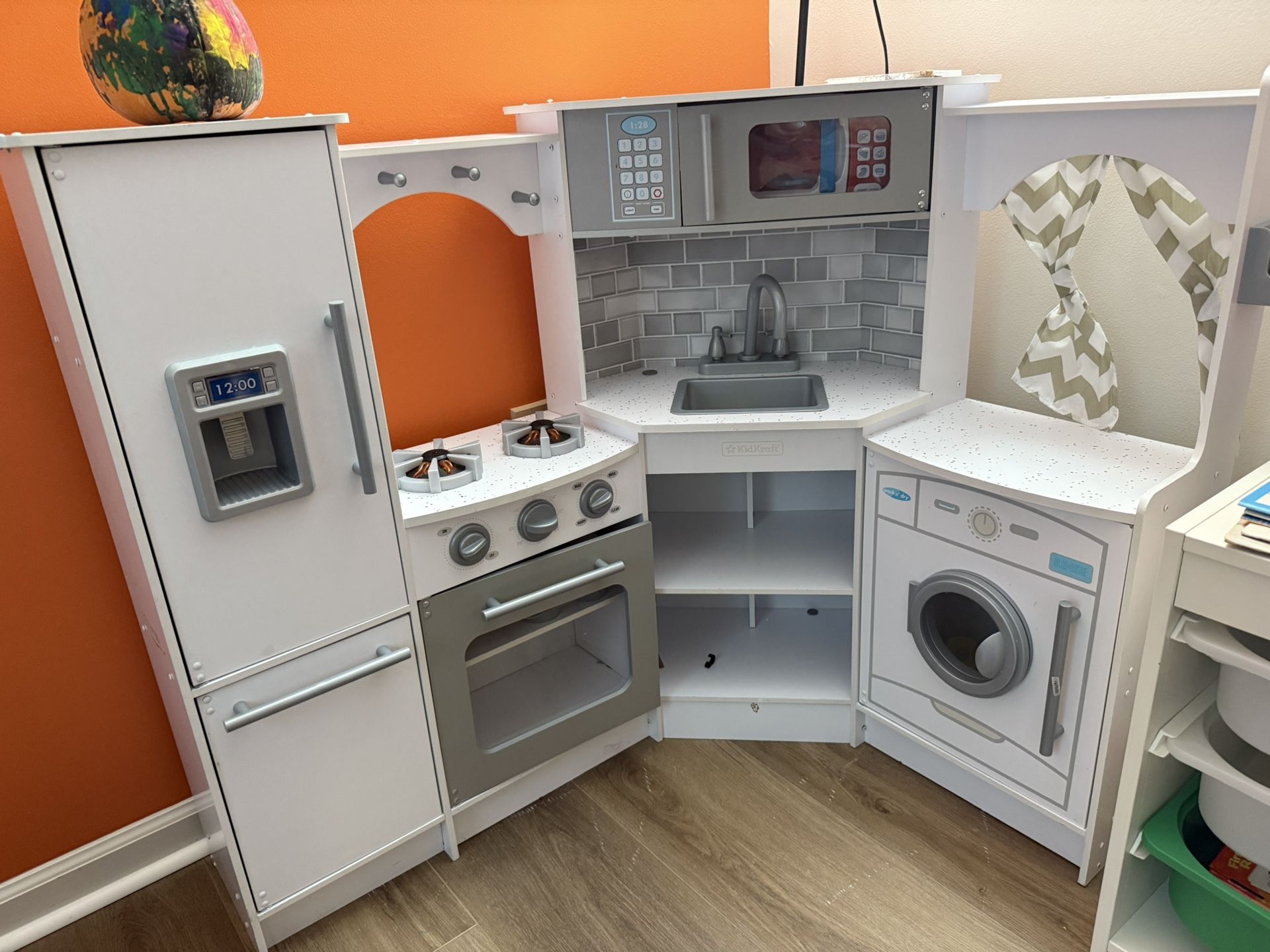 KidKraft Ultimate Corner Wooden Play Kitchen, with Pretend Food And Toys Included