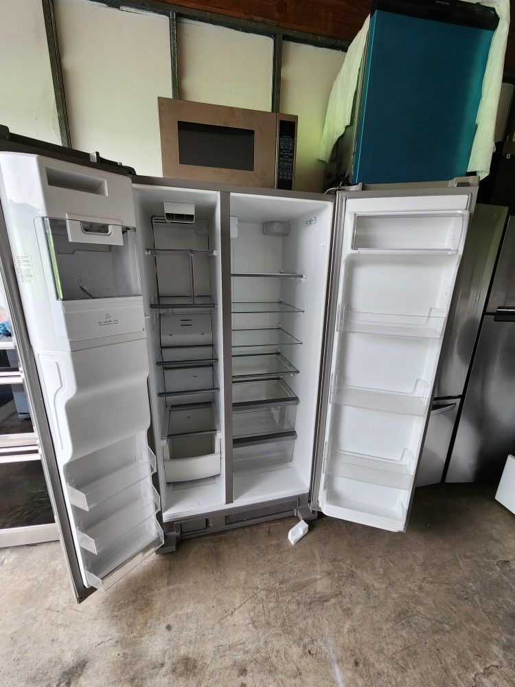 A 2-door refrigerator measuring 36 inches wide by 69 inches high by 28 inches deep, Whirlpool brand
