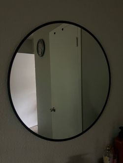 Mirror with metal frame
