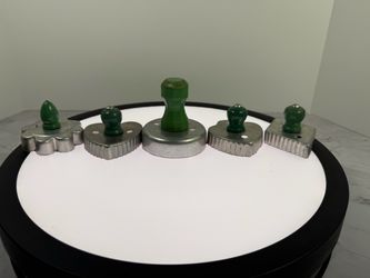 Lot of (5) Vntage aluminum cookie cutters with green wooden handles.