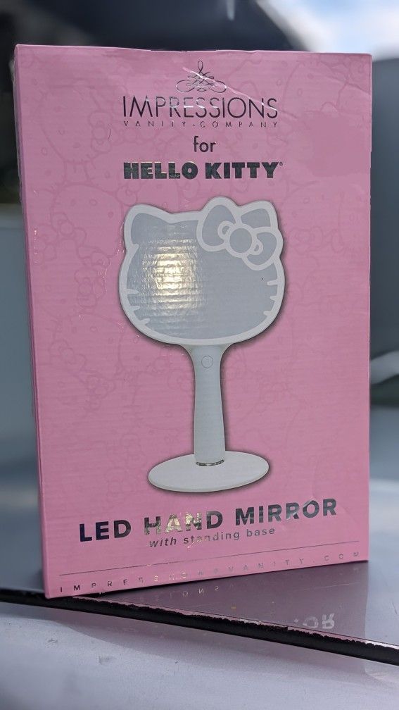 NEW, UNOPENED! Impressions Vanity Hello Kitty Led Handheld Makeup Mirror With Standing Base