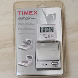 The TIMEX Flip Top Travel Alarm Clock AM/FM Portable Radio Model T315S Sealed