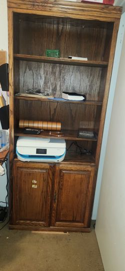 Tall wood bookcase with storage cabinet