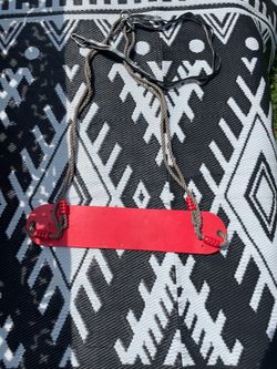 Red kids swing with durable rope