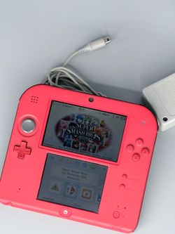 Red Nintendo 2ds with smash bros ,  charger and memory card