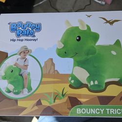 NEW  Bouncy pals triceratops ride on toy. 