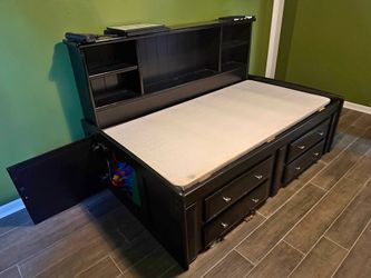Twin size platform bed with shelves drawers and crawl area